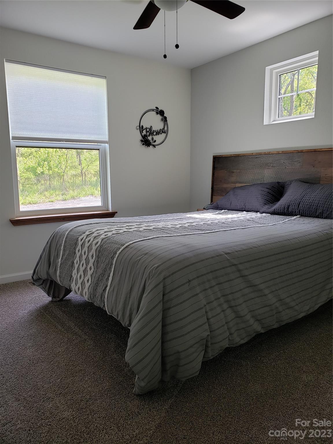 204 Mountain Spring Lane Canton, NC 28716 - Photo 10 of 18 a bedroom with a bed and a window