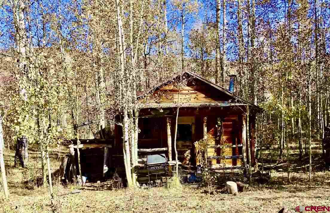 0 Groundhog Reservoir Road, Unit POND ROCK ELK & CATTLE Norwood, CO 81423 - Photo 22 of 35 an outdoor view of a house