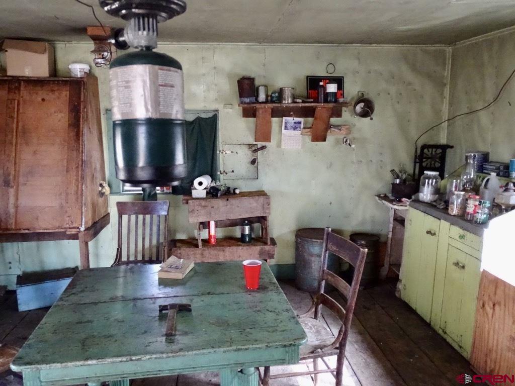 0 Groundhog Reservoir Road, Unit POND ROCK ELK & CATTLE Norwood, CO 81423 - Photo 23 of 35 a room with storage and utility