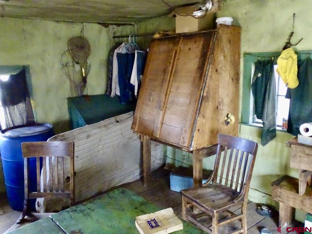 0 Groundhog Reservoir Road, Unit POND ROCK ELK & CATTLE Norwood, CO 81423 - Photo 24 of 35 a living room with furniture