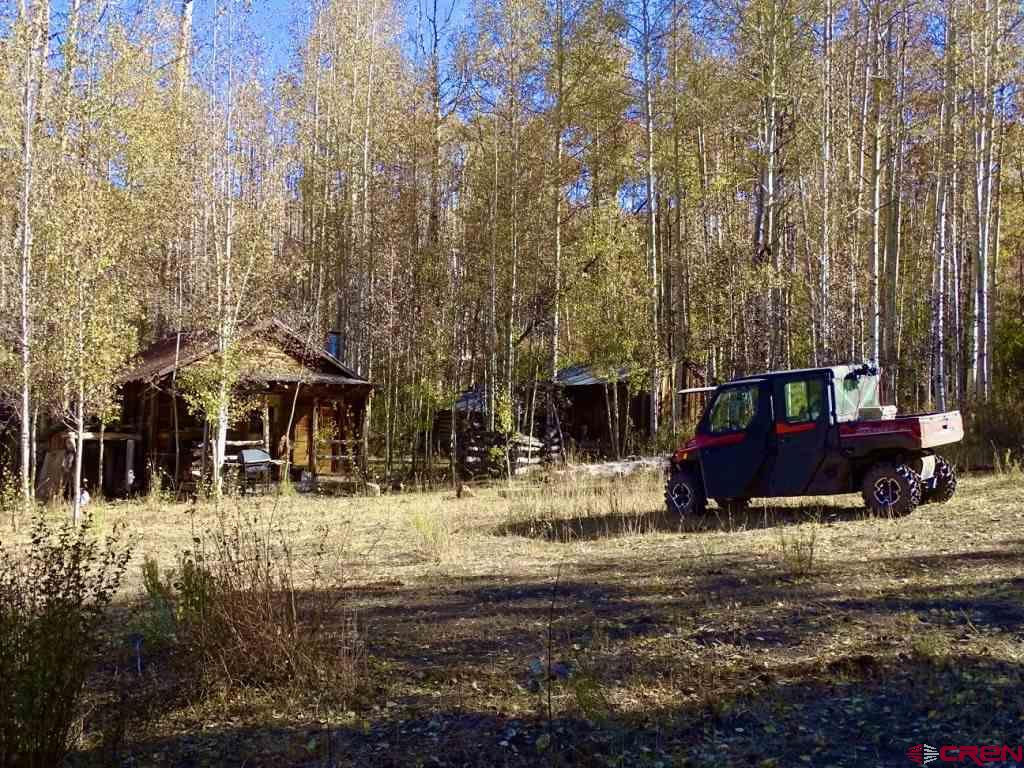 0 Groundhog Reservoir Road, Unit POND ROCK ELK & CATTLE Norwood, CO 81423 - Photo 27 of 35 a view of a house with a yard