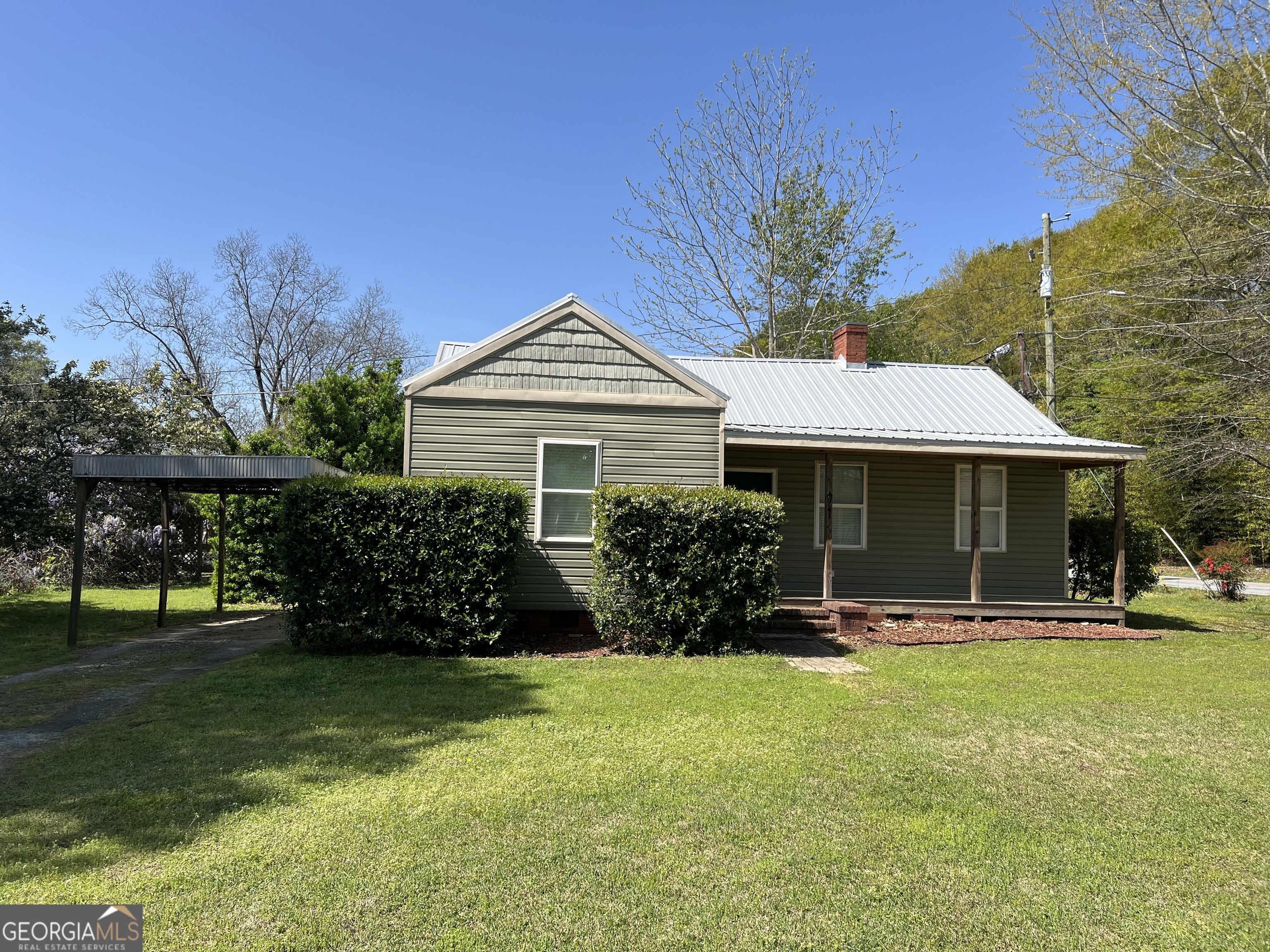 4941 Old Atlanta Road Hampton, GA 30228 - Photo 1 of 1 a front view of a house with garden