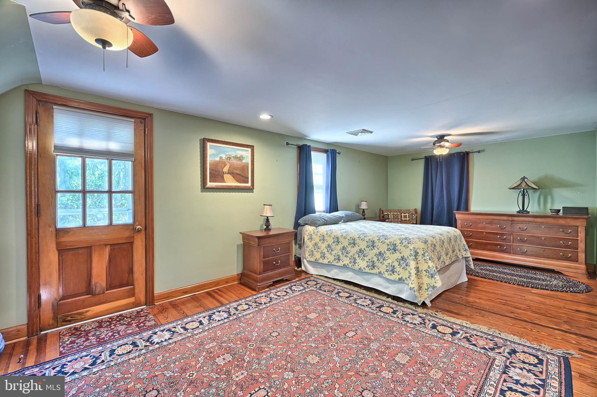 124 Market Street Lititz, PA 17543 - Photo 16 of 35 a spacious bedroom with a large bed and a dresser
