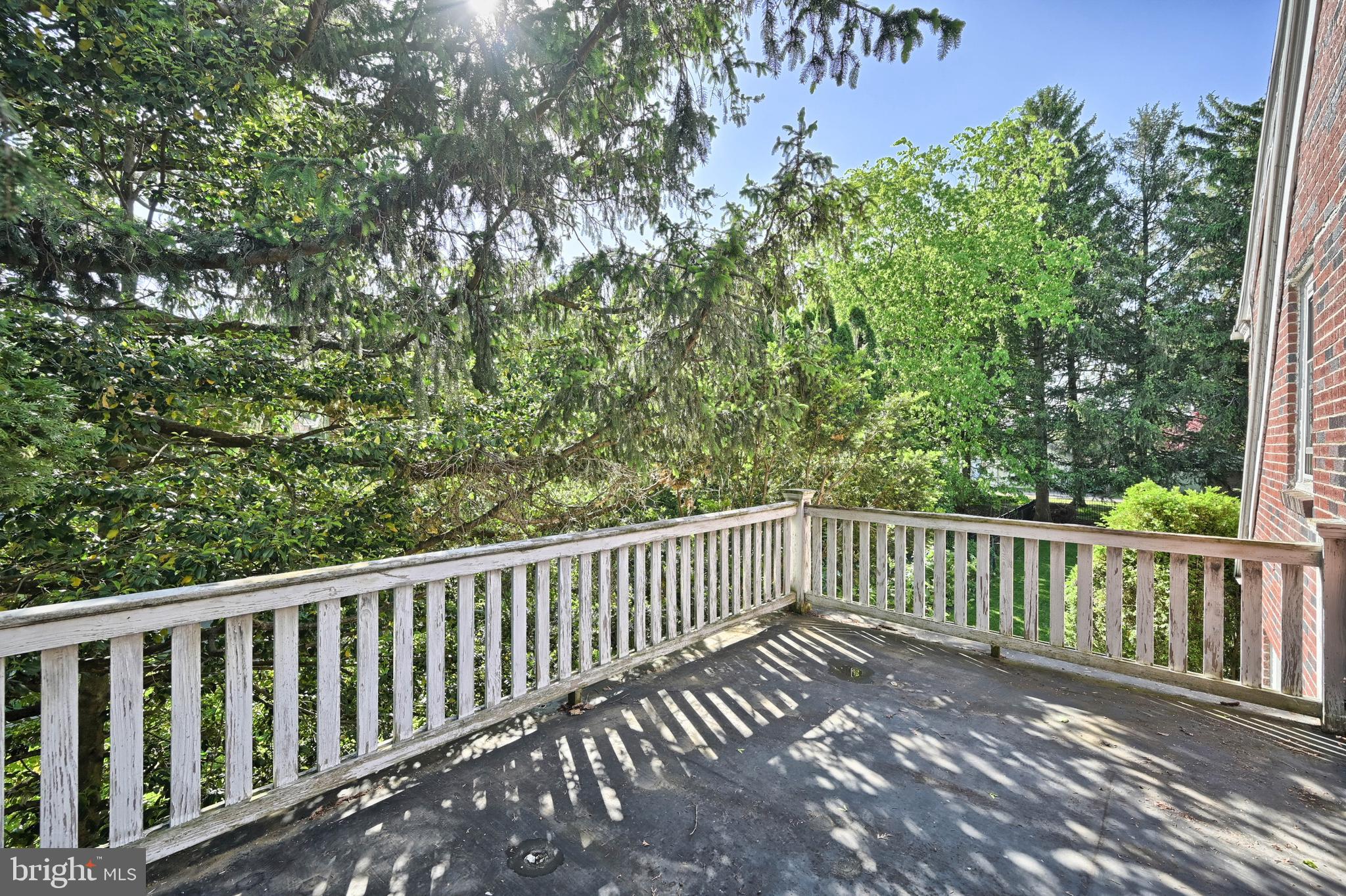 124 Market Street Lititz, PA 17543 - Photo 24 of 35 a balcony with wooden floor and fence