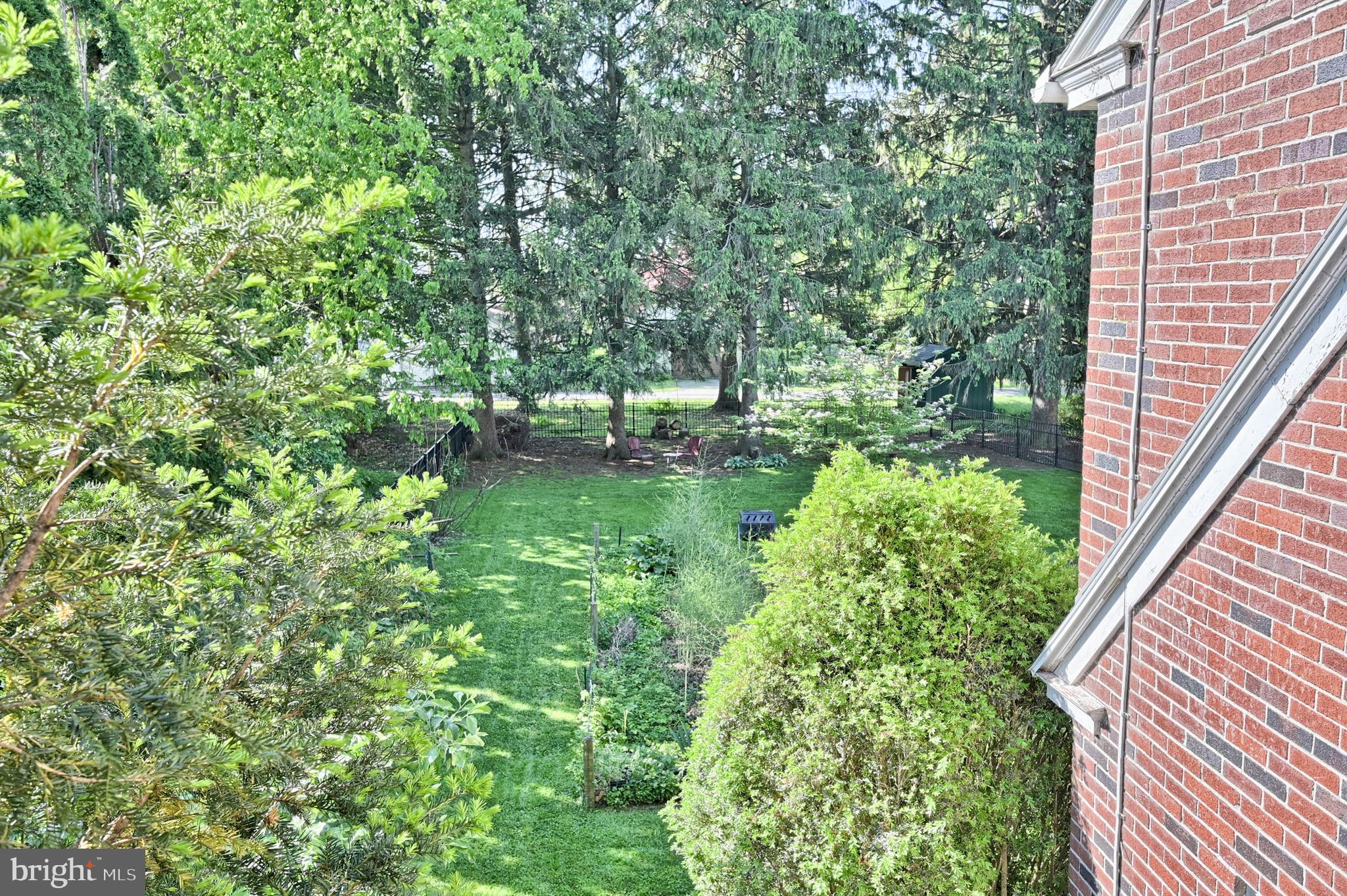 124 Market Street Lititz, PA 17543 - Photo 26 of 35 a backyard of a house with a lots of plants and a tree