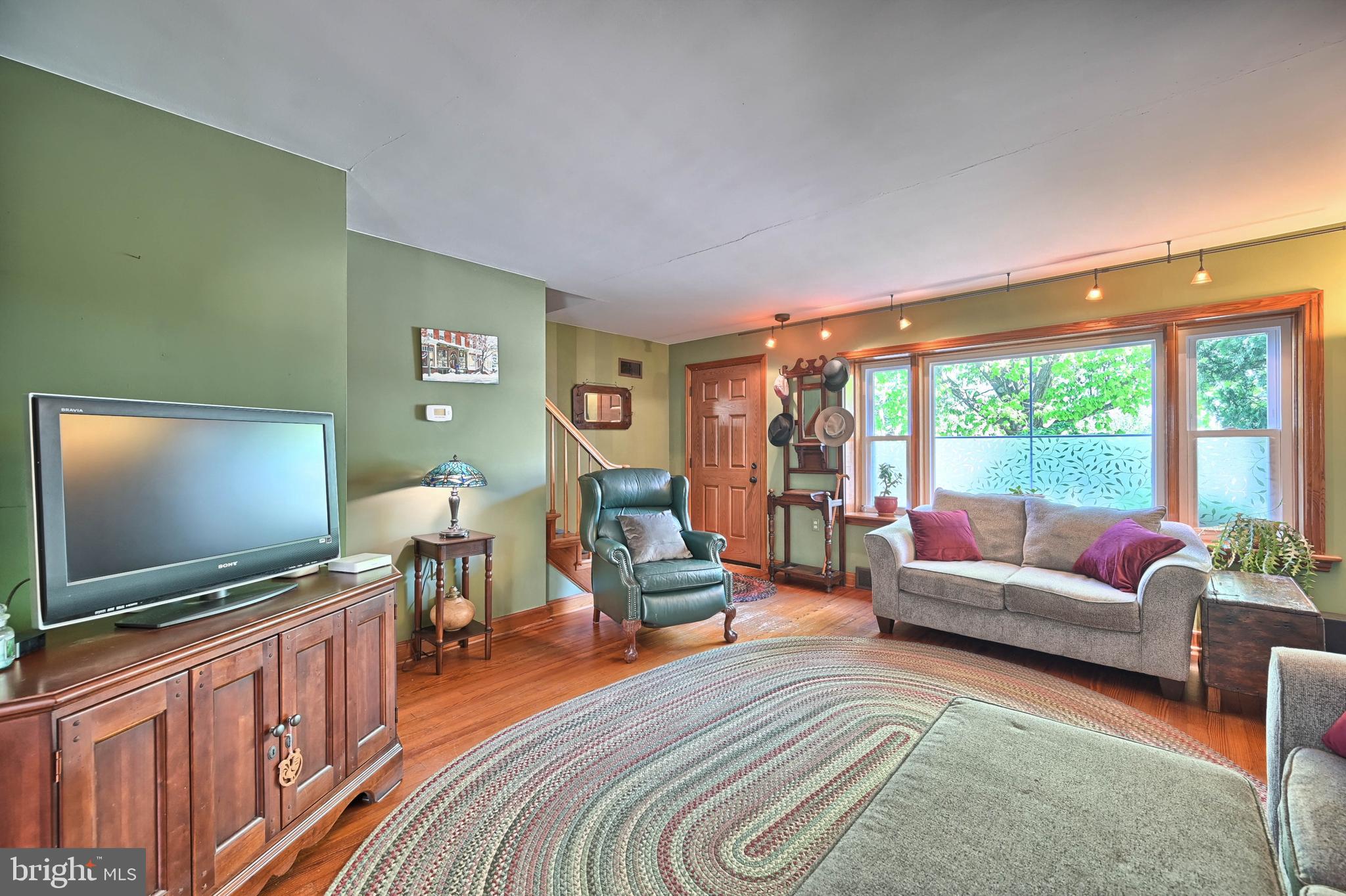 124 Market Street Lititz, PA 17543 - Photo 4 of 35 a living room with furniture and a flat screen tv
