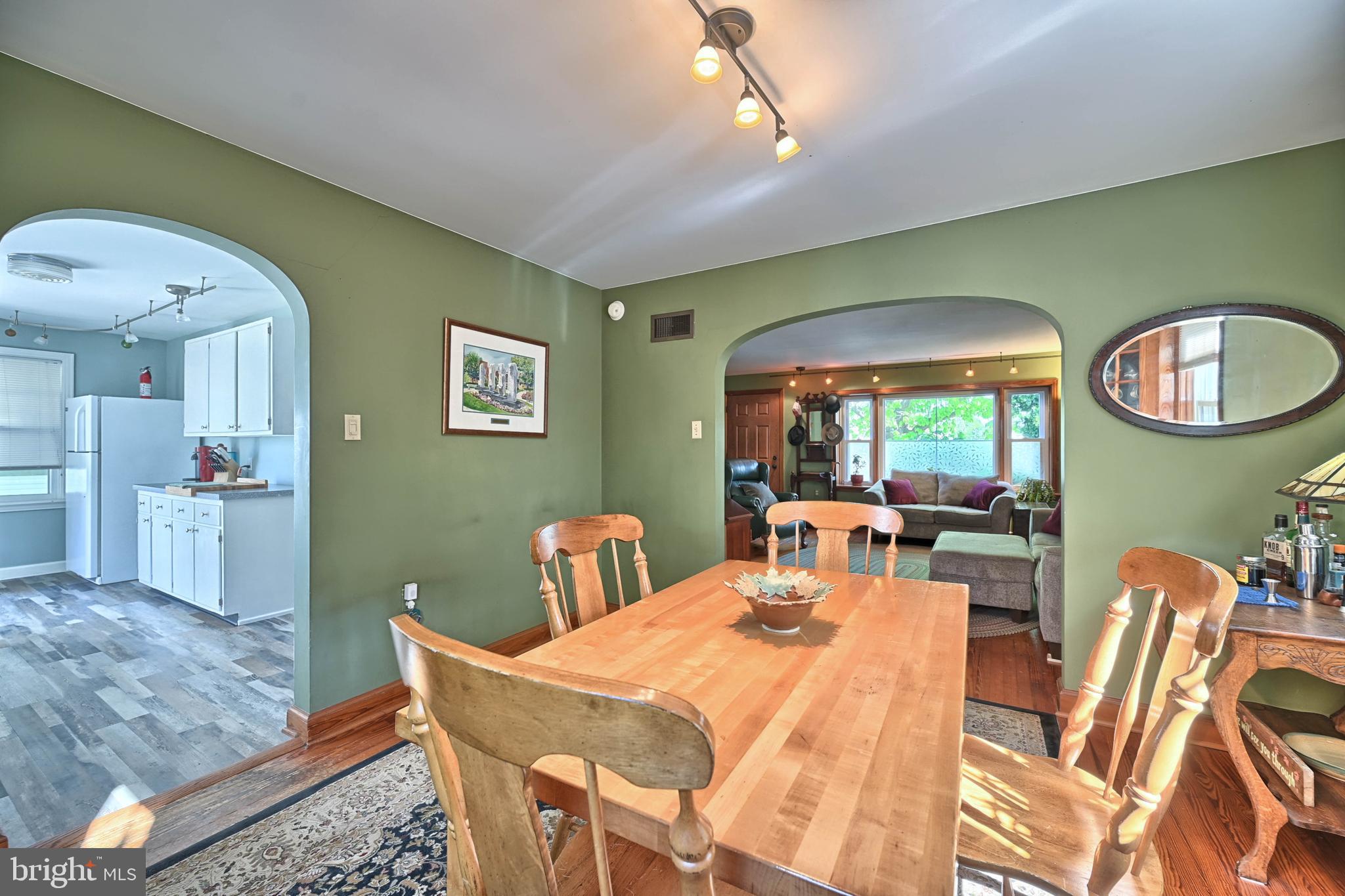 124 Market Street Lititz, PA 17543 - Photo 7 of 35 a view of a dining room with furniture and a chandelier