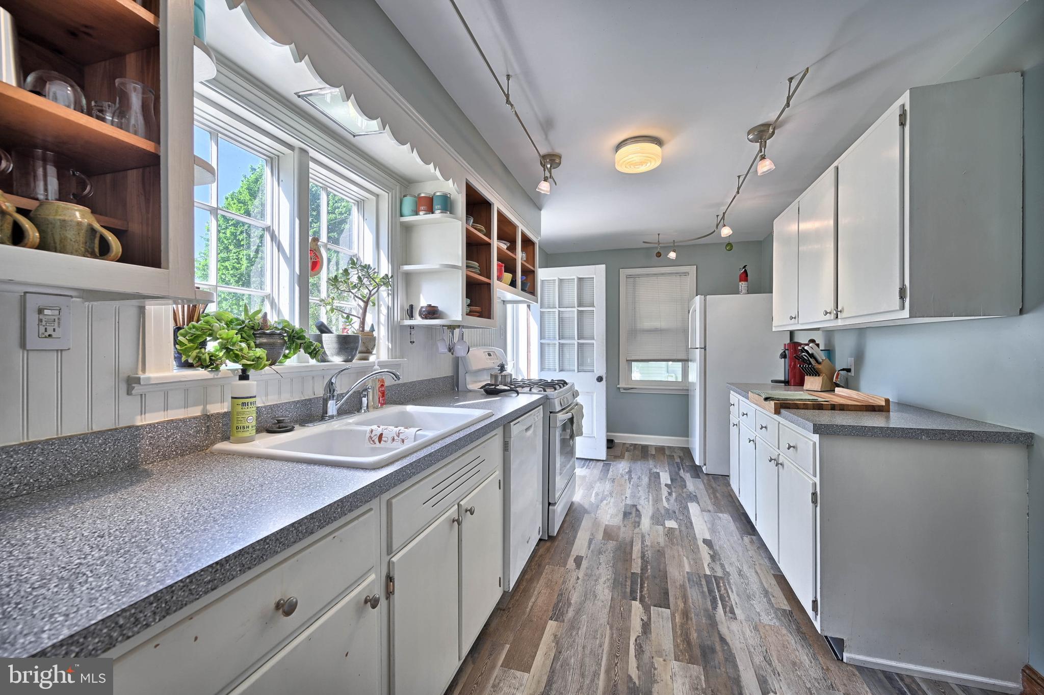 124 Market Street Lititz, PA 17543 - Photo 8 of 35 a large kitchen with stainless steel appliances lots of counter space wooden floor and window