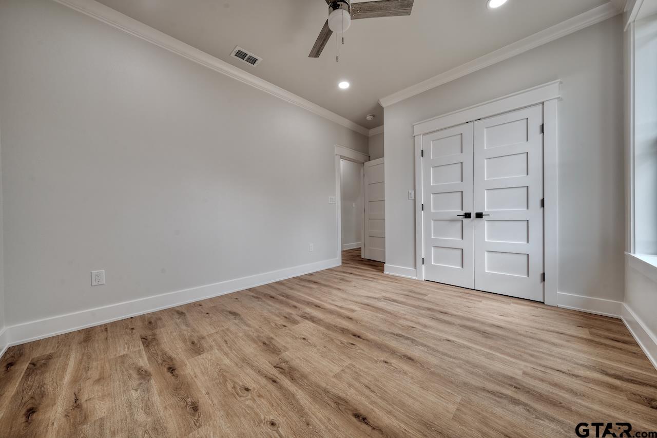 19383 Ridge Point Circle Lindale, TX 75771 - Photo 35 of 48 wooden floor in an empty room