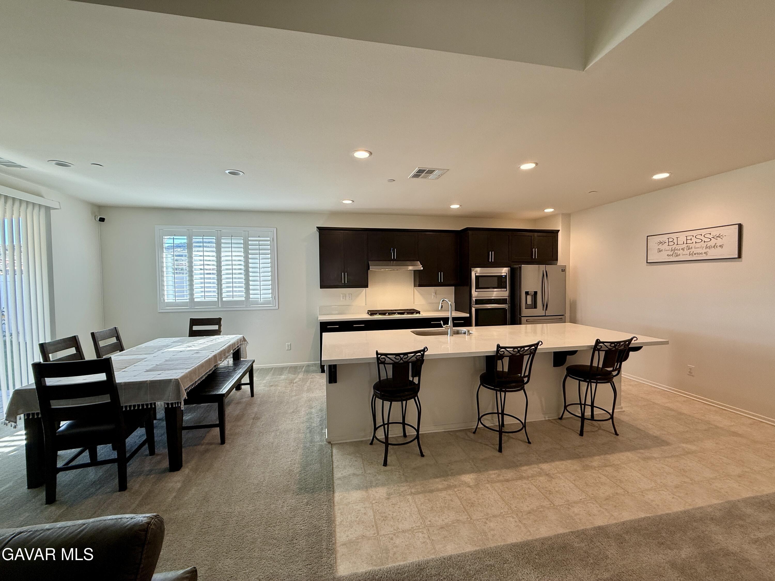 38902 Malva Rosa Drive Palmdale, CA 93551 - Photo 4 of 12 a view of a dining room with furniture