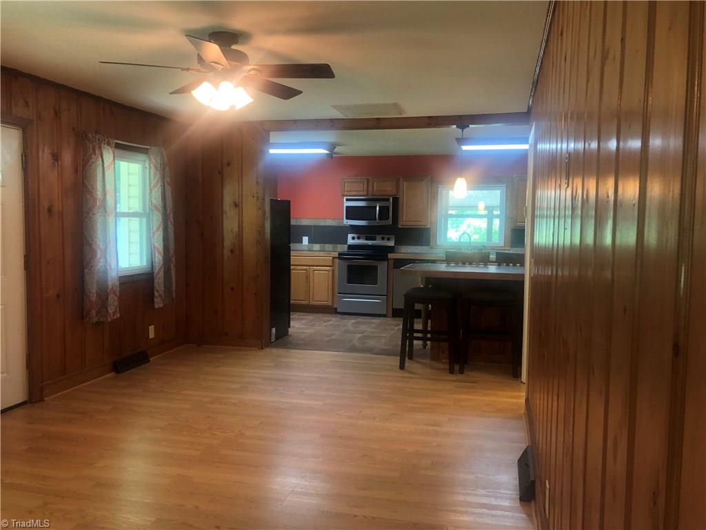 1419 Old Winston Road Pinnacle, NC 27043 - Photo 8 of 29 Living room looking into the kitchen