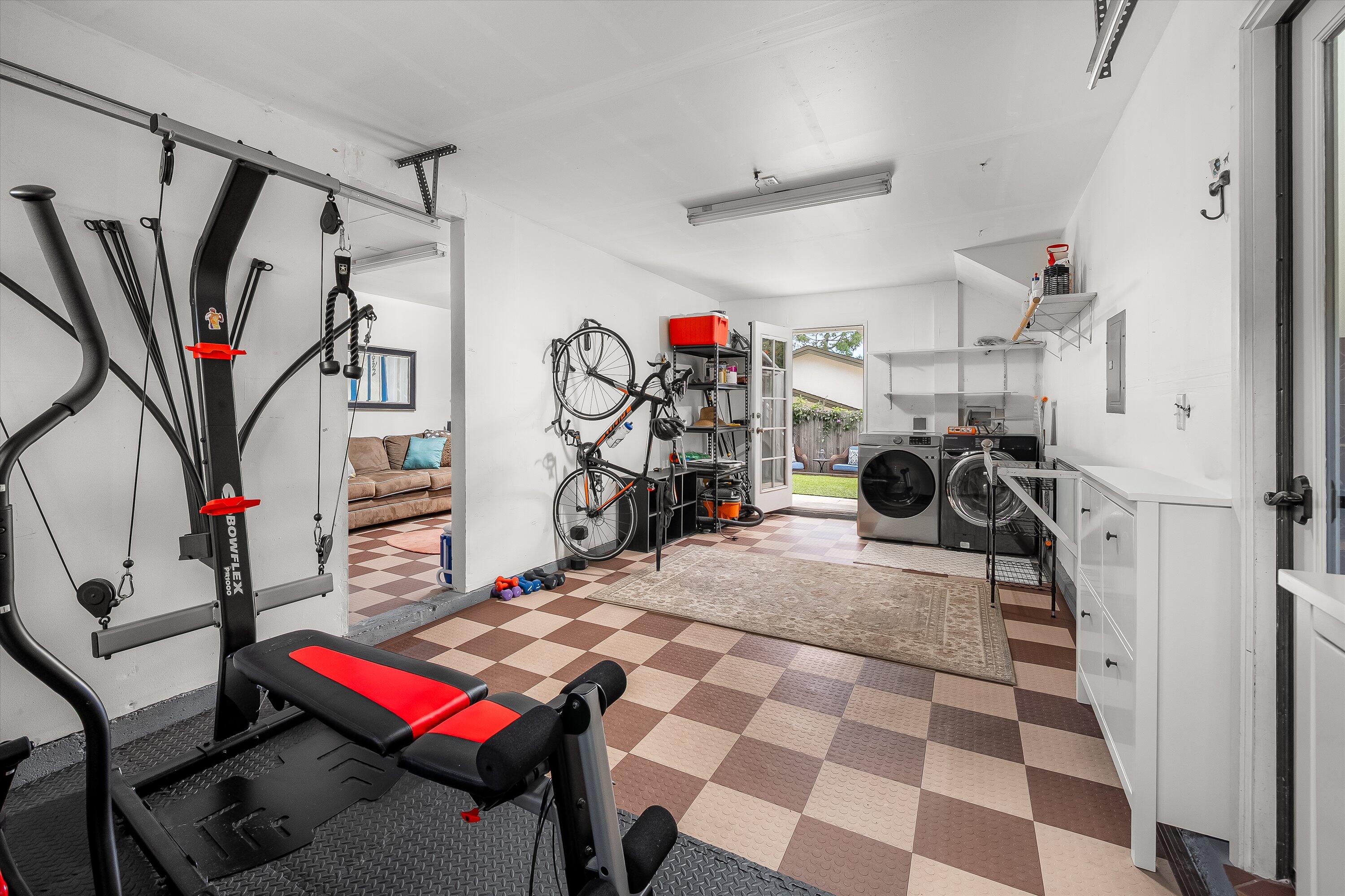 4013 Invierno Drive, Unit B Santa Barbara, CA 93110 - Photo 11 of 15 a living room with lots of furniture and a gym equipment
