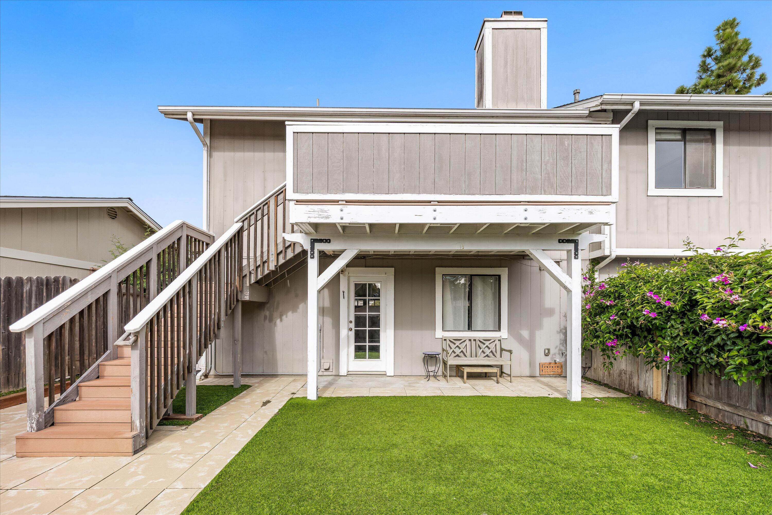 4013 Invierno Drive, Unit B Santa Barbara, CA 93110 - Photo 13 of 15 a view of a house with wooden floor and a yard