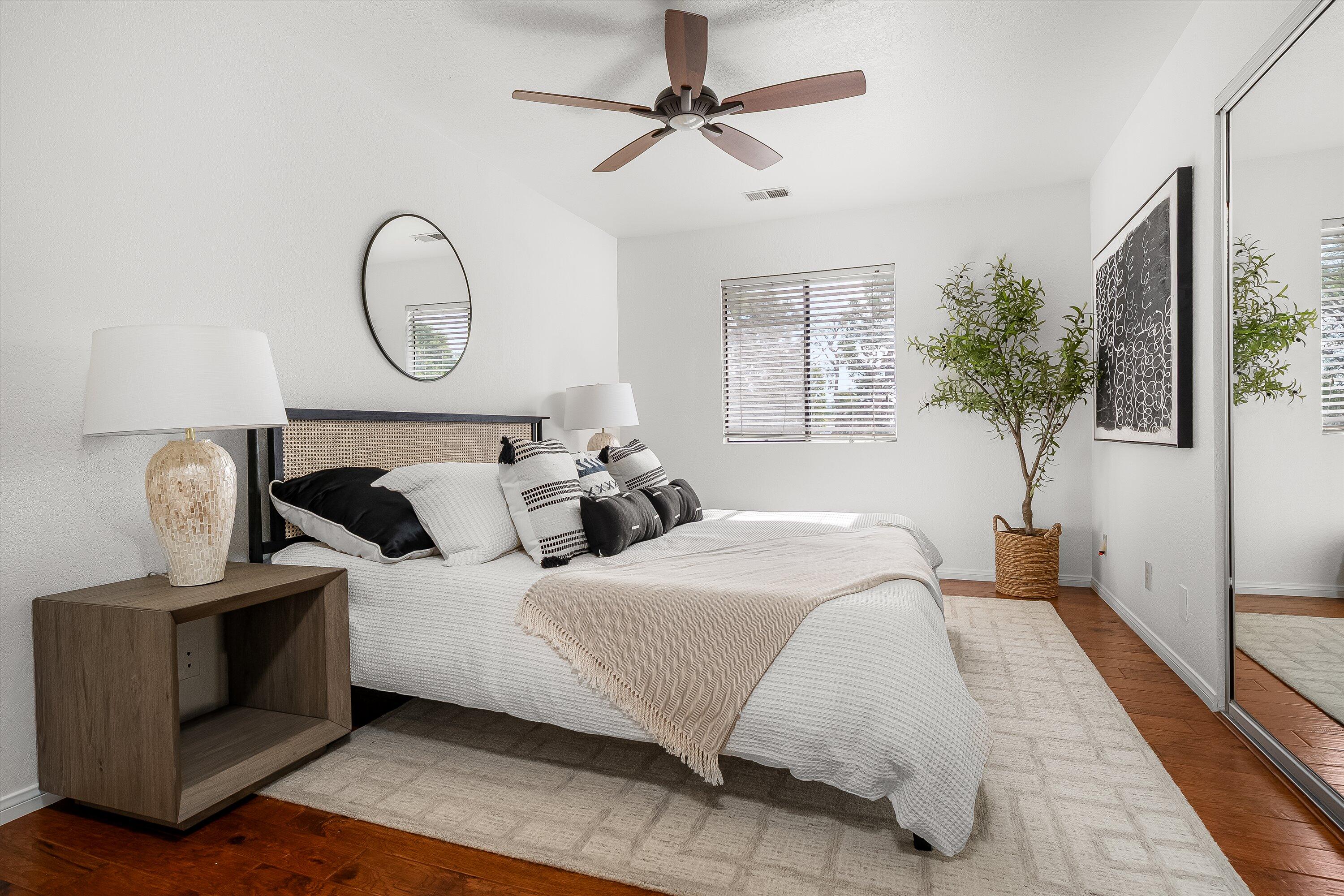 4013 Invierno Drive, Unit B Santa Barbara, CA 93110 - Photo 8 of 15 a bedroom with bed and a chandelier