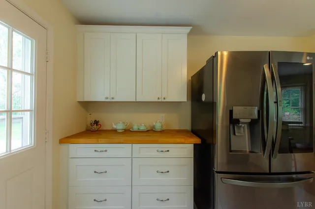 a living room with furniture fireplace and a flat screen tv