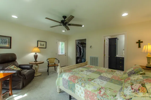 a white toilet sitting next to a bathroom sink