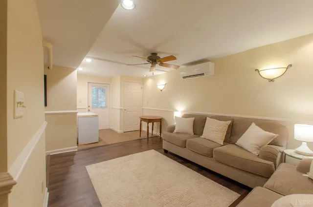 a view of backyard of house with green space