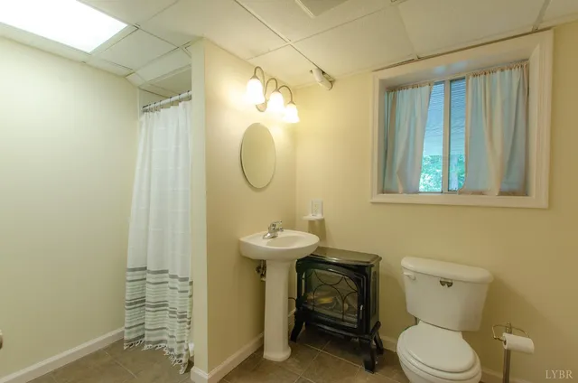 a view of a dinning table and chairs in patio of the house