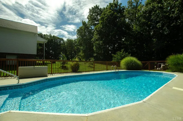 a view of a grassy field with trees