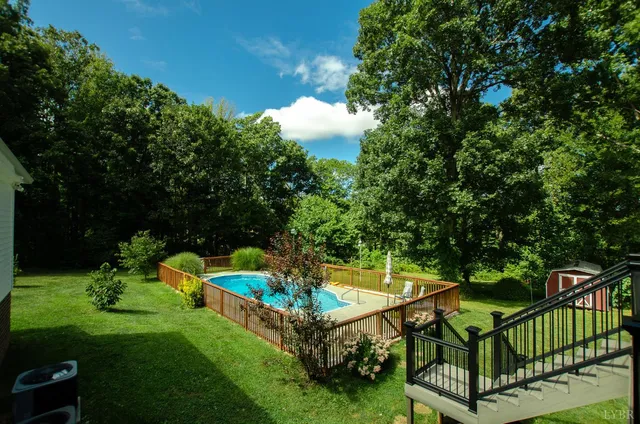 a kitchen with stainless steel appliances granite countertop a refrigerator and a stove