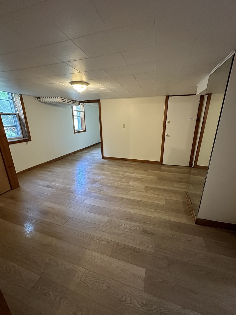 212 West High Street Urbana, IL 61801 - Photo 27 of 36 a view of a hallway with wooden floor