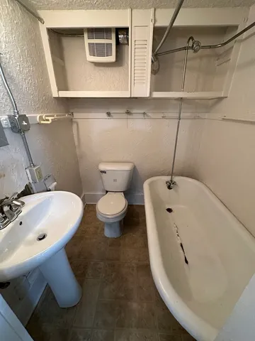 a bathroom with a sink and mirror