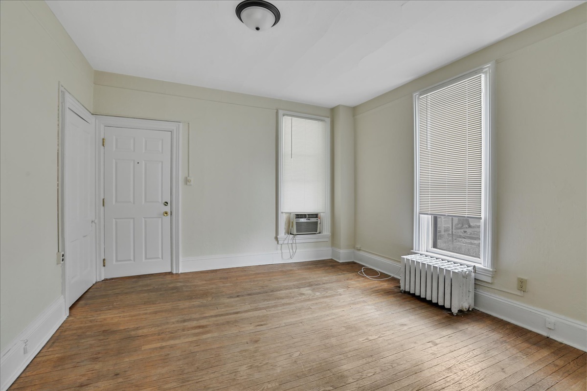212 West High Street Urbana, IL 61801 - Photo 5 of 36 a view of a room with wooden floor and a window