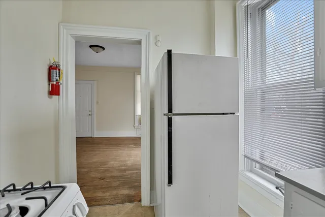 a bathroom with a shower and a sink