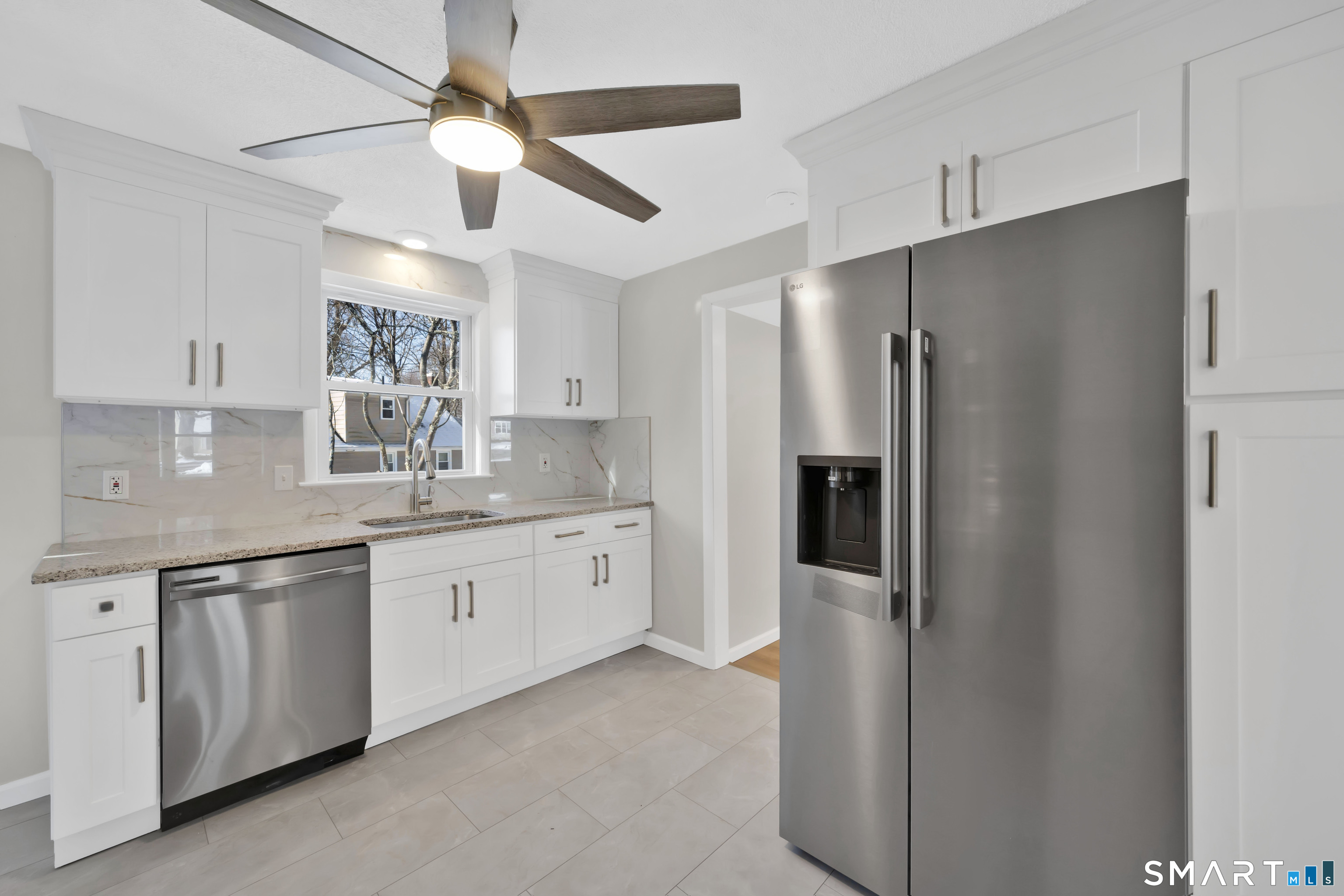 23 Bancroft Road Vernon, CT 06066 - Photo 5 of 20 a kitchen with granite countertop a refrigerator and a sink