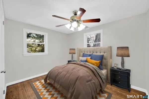 a bedroom with bed and window