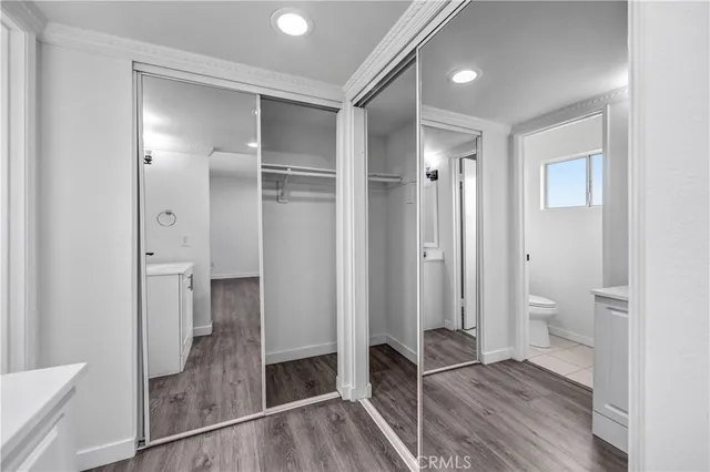a bathroom with a glass door shower and a sink