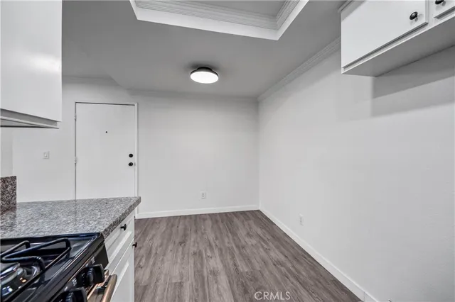 a view of a kitchen cabinets and wooden floor