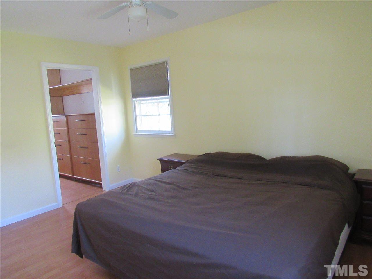 7404 Archer Circle Raleigh, NC 27615 - Photo 11 of 25 a bedroom with a bed and a window