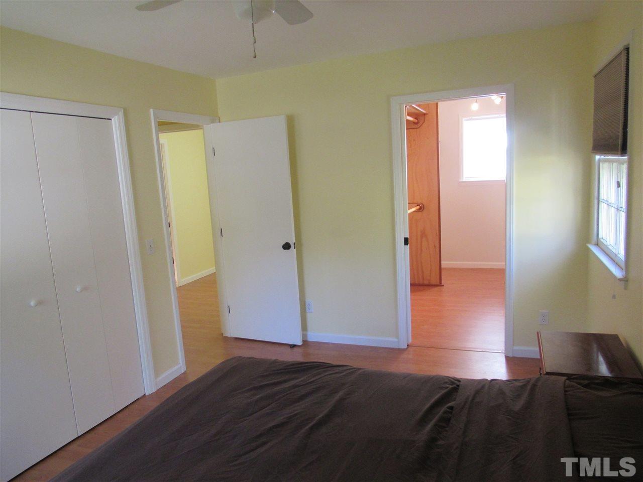 7404 Archer Circle Raleigh, NC 27615 - Photo 12 of 25 a view of hallway with window and wooden floor