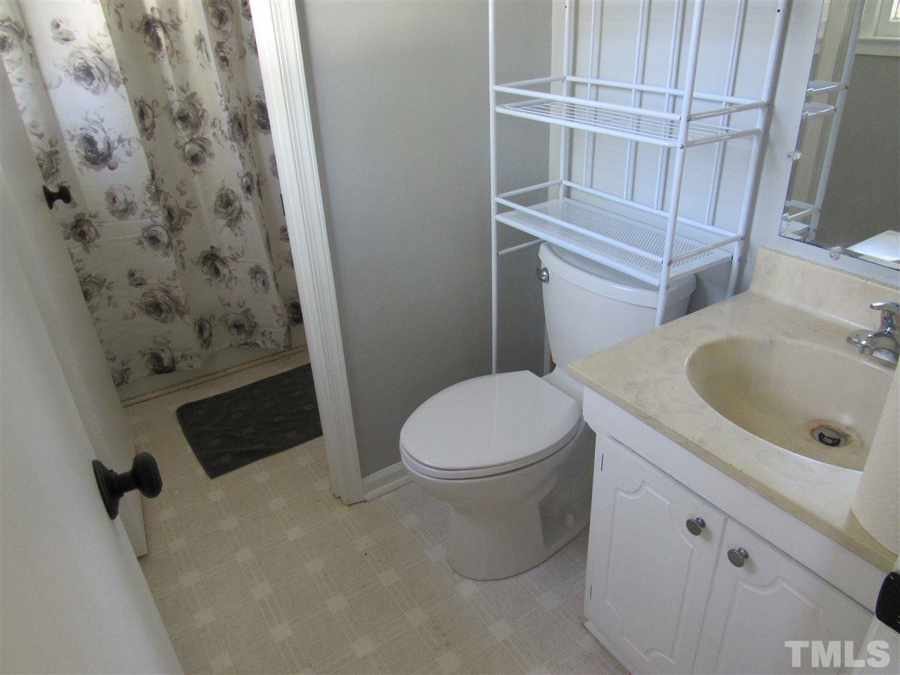 7404 Archer Circle Raleigh, NC 27615 - Photo 16 of 25 a bathroom with a toilet and a sink