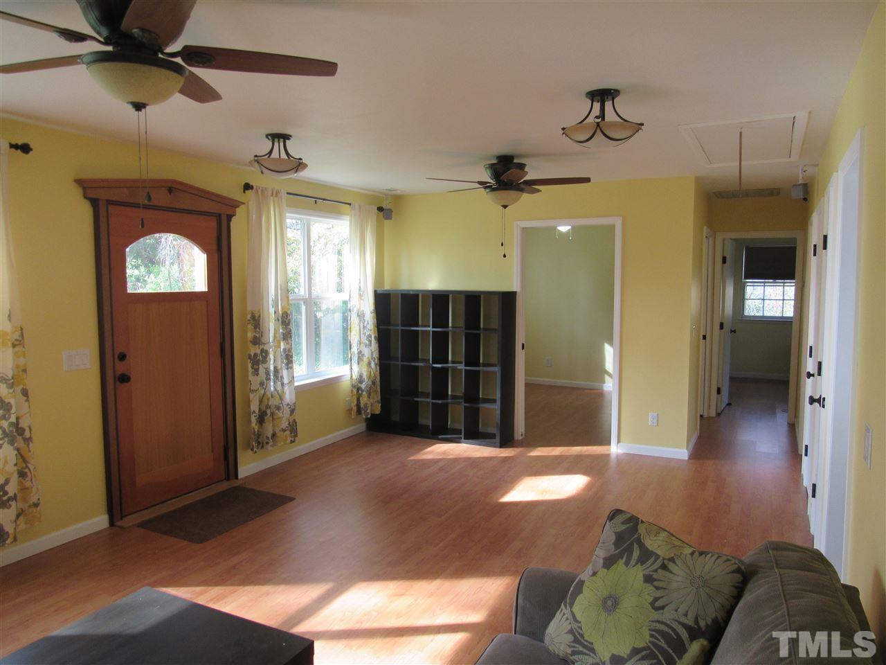 7404 Archer Circle Raleigh, NC 27615 - Photo 4 of 25 a view of a livingroom with a chandelier