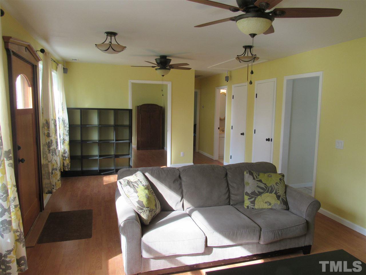 7404 Archer Circle Raleigh, NC 27615 - Photo 6 of 25 a living room with furniture and a large window