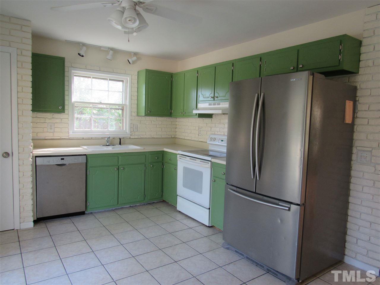 7404 Archer Circle Raleigh, NC 27615 - Photo 9 of 25 a kitchen with a refrigerator and a sink