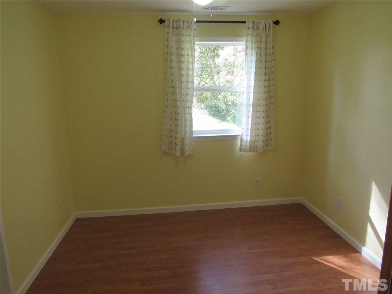 7404 Archer Circle Raleigh, NC 27615 - Photo 10 of 25 an empty room with a window
