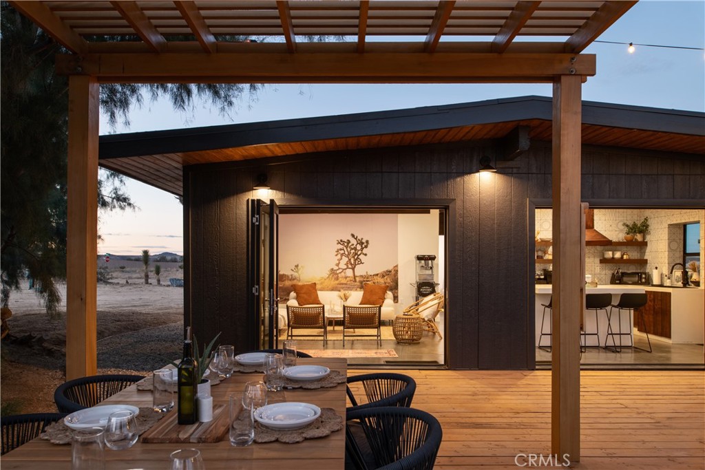 a dining room with furniture and wooden floor