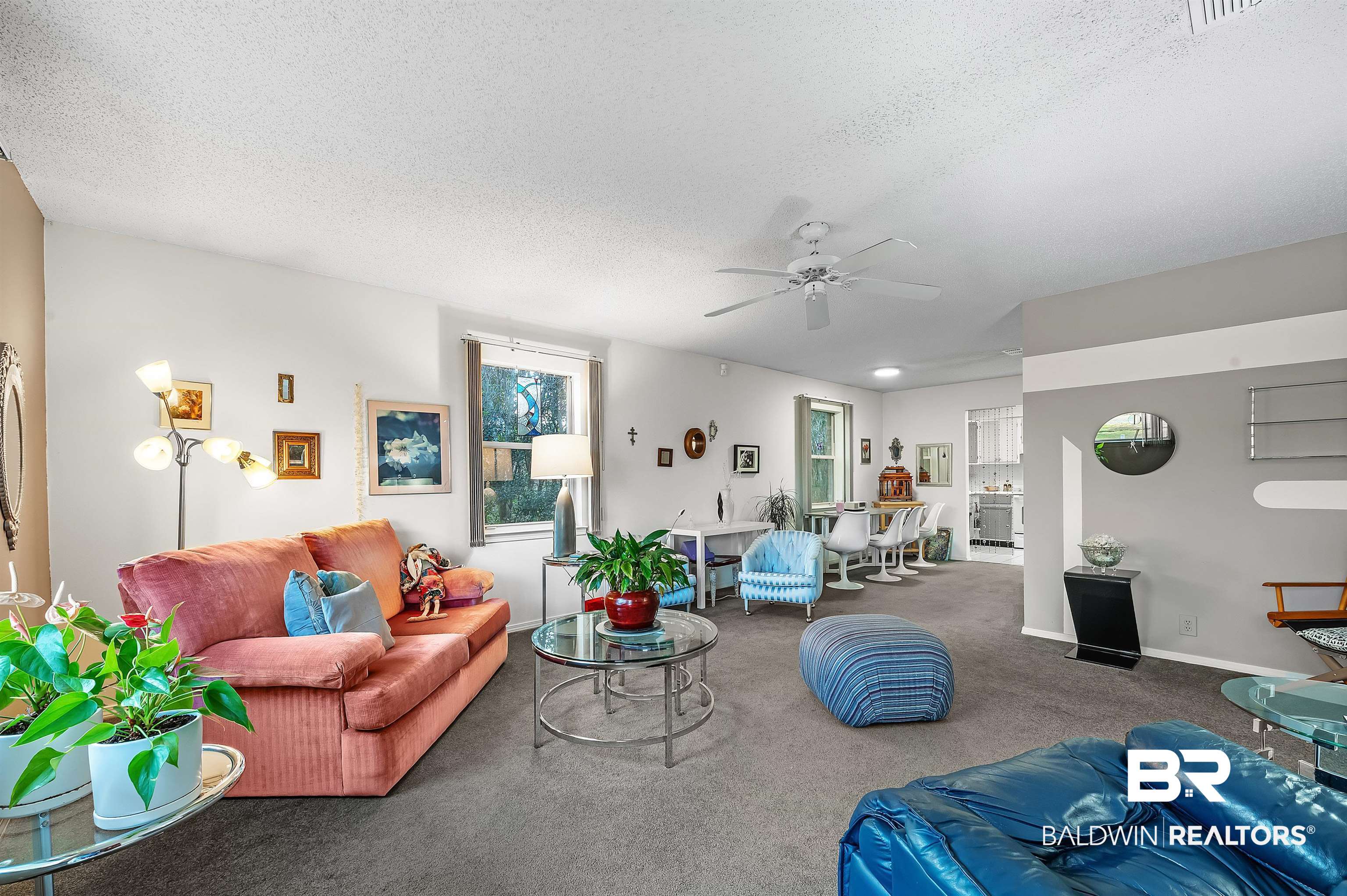 526 Ariel Avenue Foley, AL 36535 - Photo 12 of 33 Carpeted living room with ceiling fan and a textured ceiling
