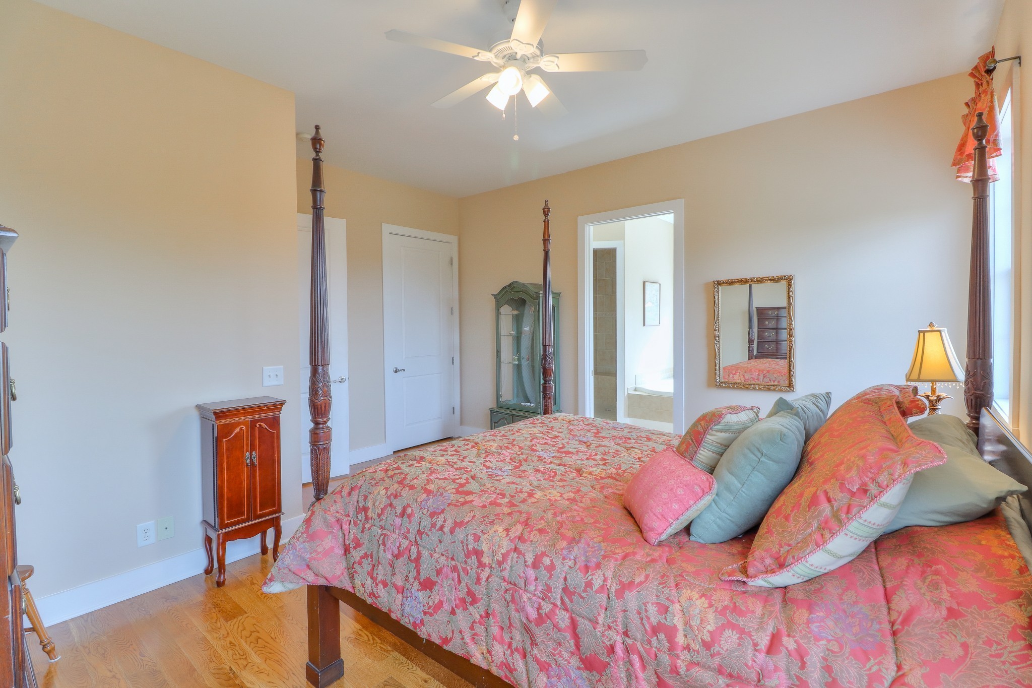 1298 Berea Church Road Lebanon, TN 37087 - Photo 15 of 50 a bedroom with a bed and a chandelier