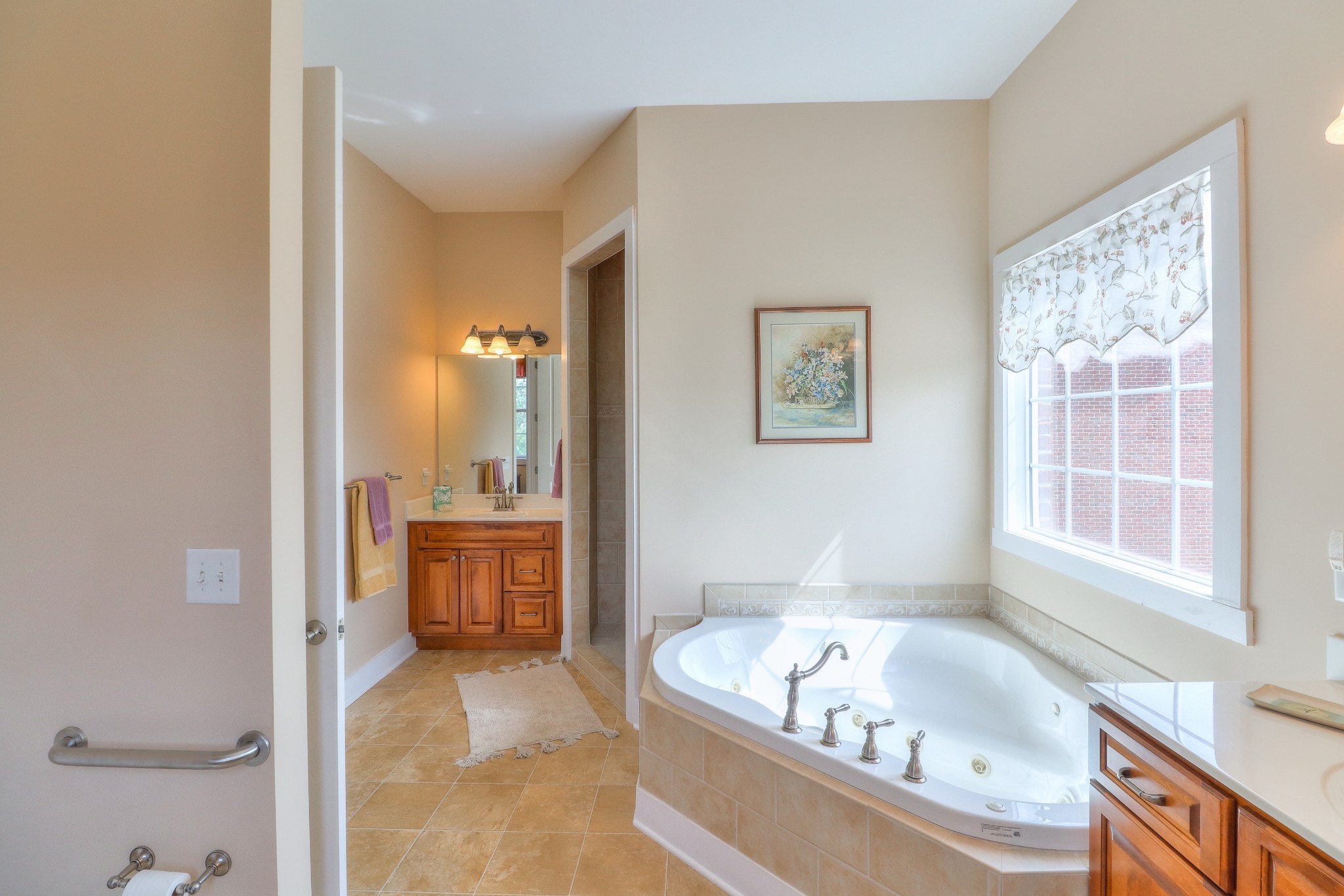 1298 Berea Church Road Lebanon, TN 37087 - Photo 16 of 50 a bathroom with a tub a sink and a large mirror
