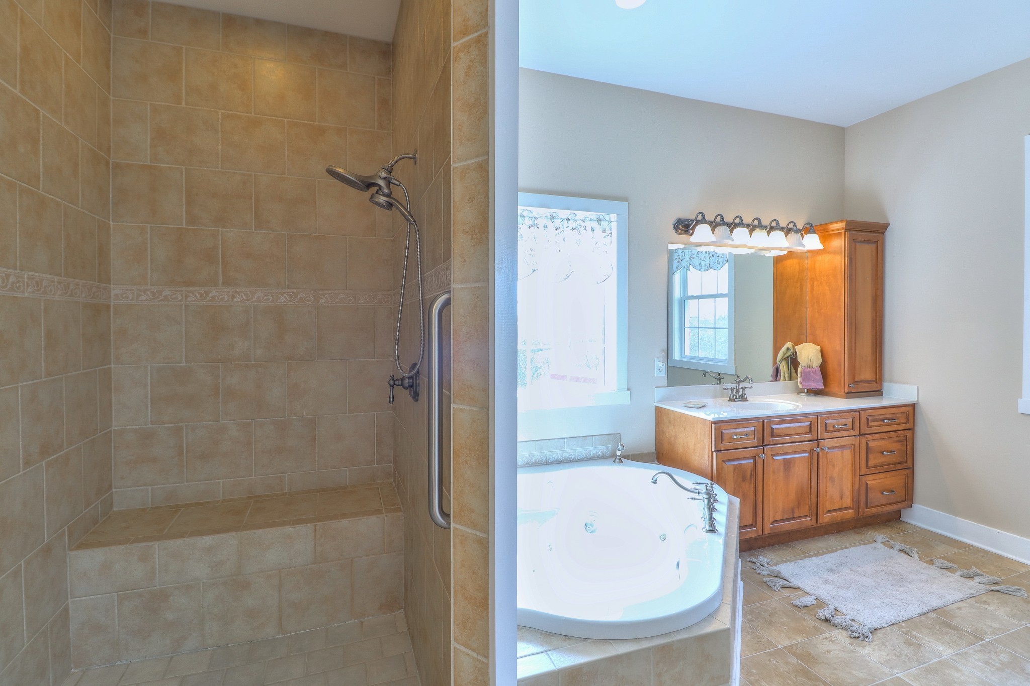 1298 Berea Church Road Lebanon, TN 37087 - Photo 17 of 50 a bathroom with a tub a sink a mirror and a shower