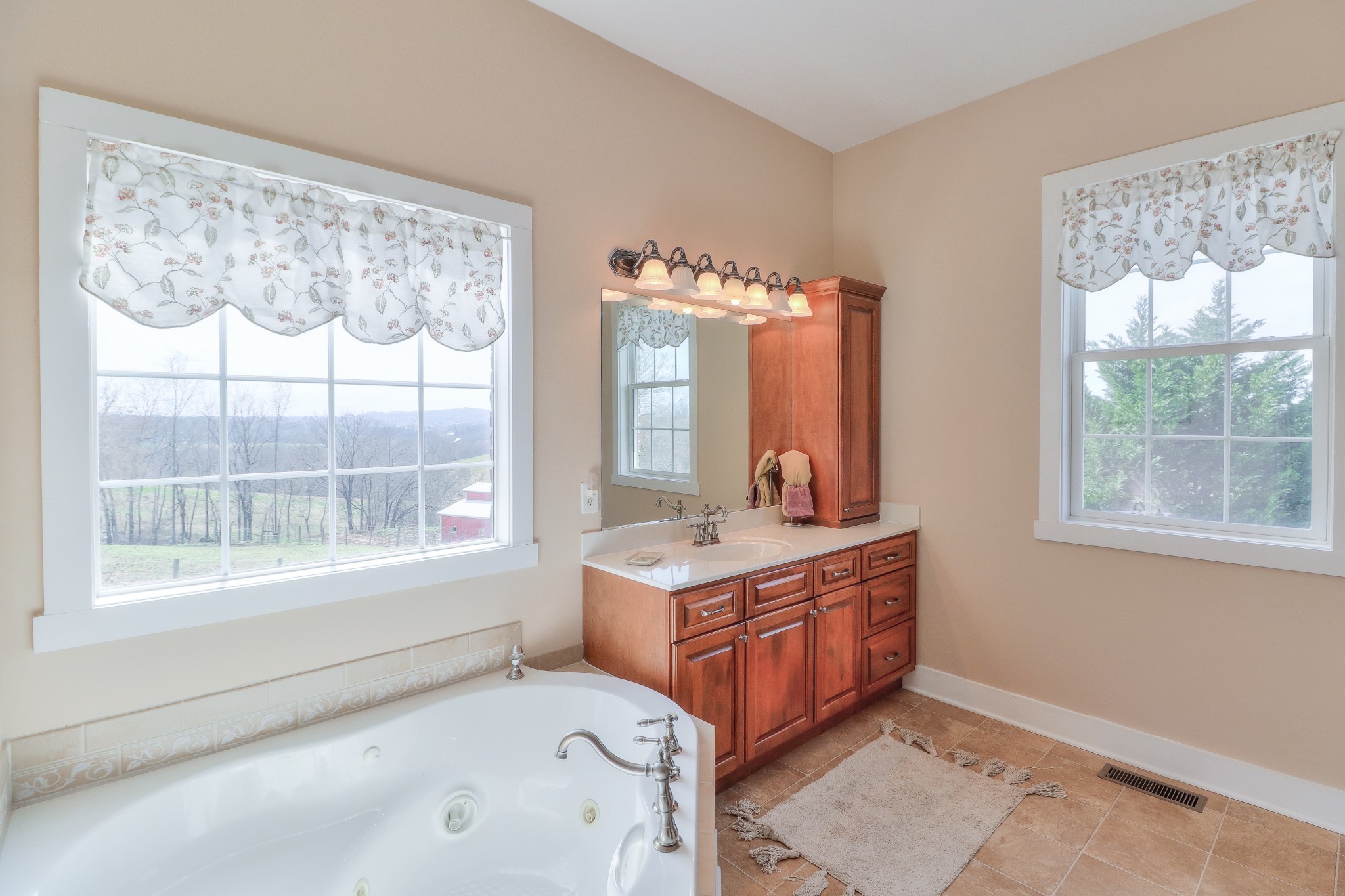 1298 Berea Church Road Lebanon, TN 37087 - Photo 18 of 50 a spacious bathroom with a granite countertop sink and a large mirror