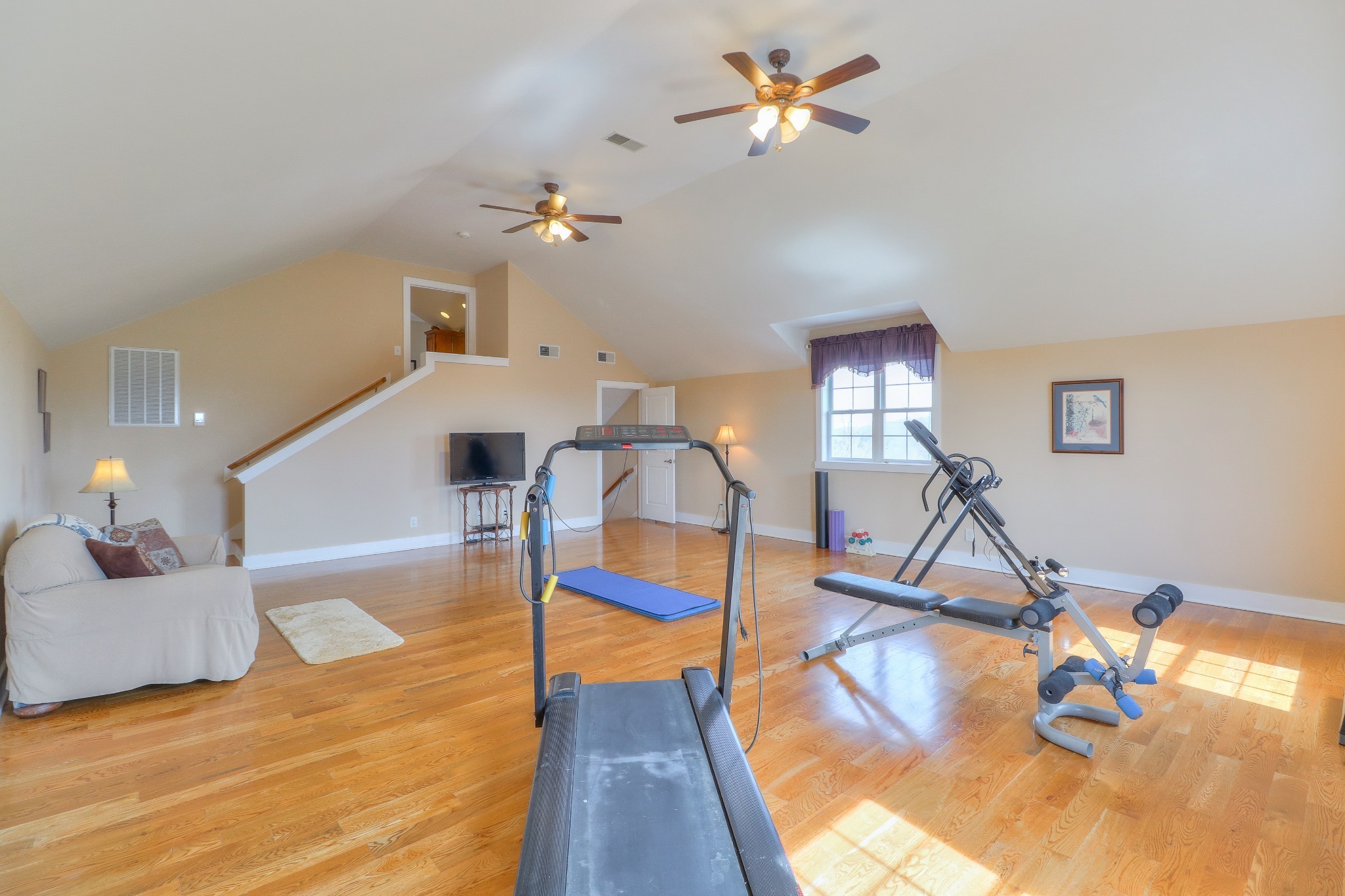 1298 Berea Church Road Lebanon, TN 37087 - Photo 22 of 50 a view of a livingroom with furniture a chandelier fan and wooden floor