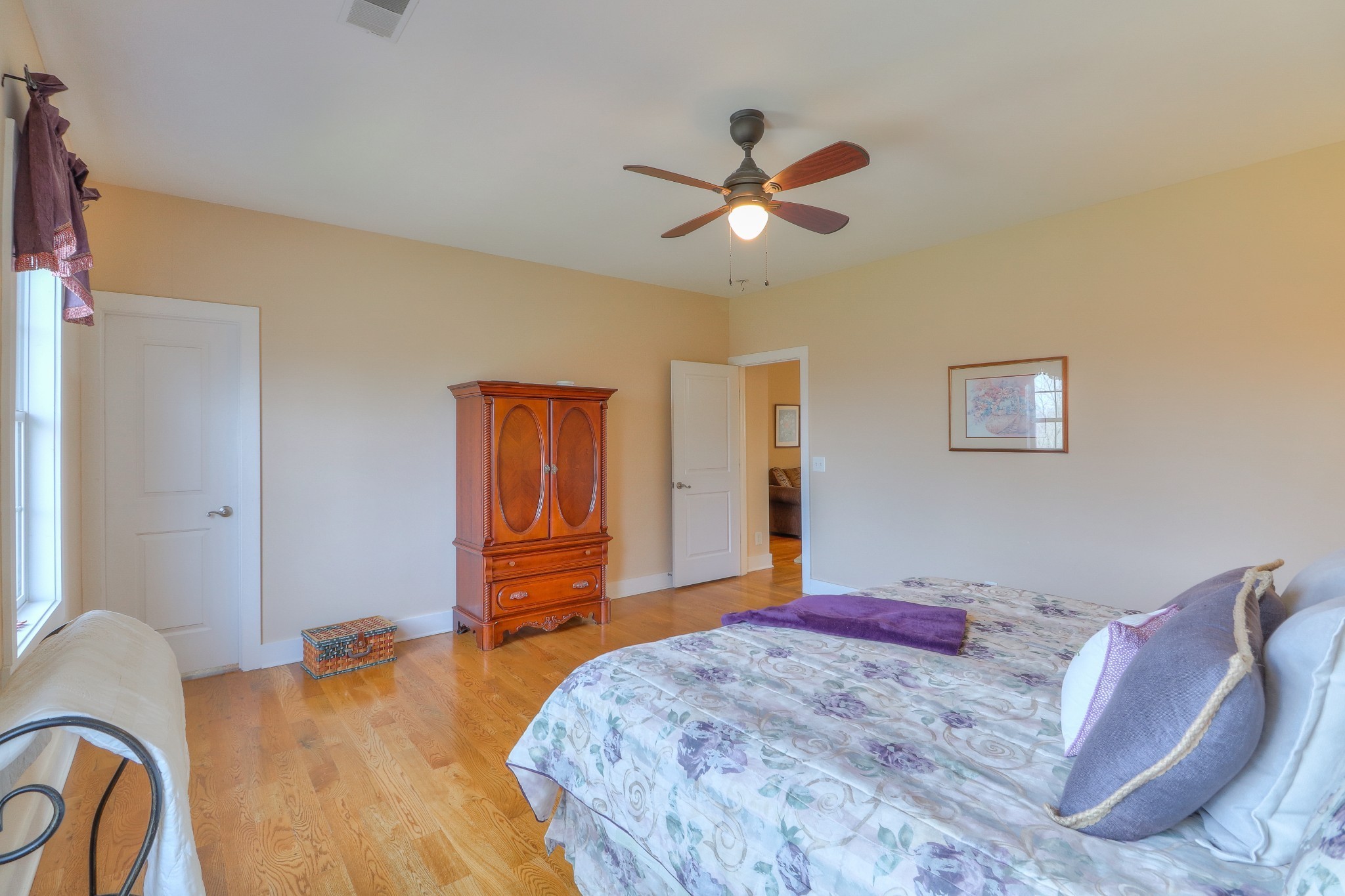 1298 Berea Church Road Lebanon, TN 37087 - Photo 31 of 50 a bedroom with a bed and a chandelier