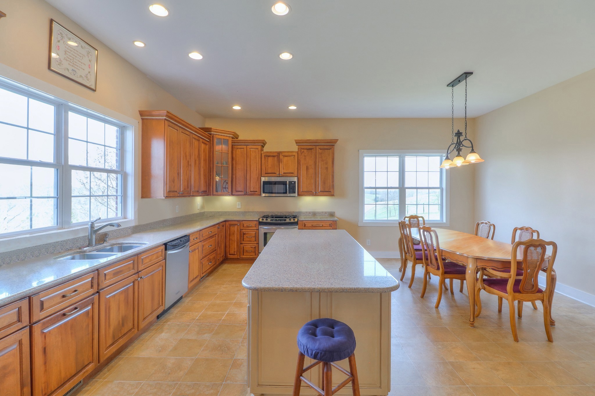 1298 Berea Church Road Lebanon, TN 37087 - Photo 9 of 50 a kitchen with stainless steel appliances granite countertop a sink a stove a dining table and chairs