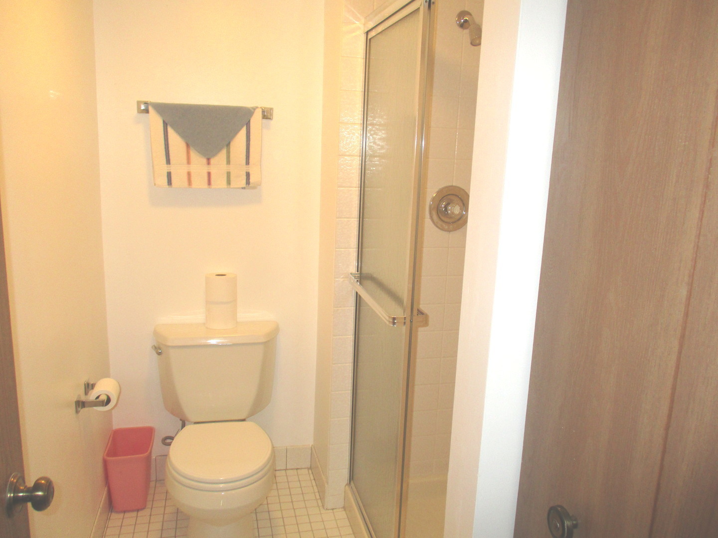 10532 Ridge Cove Drive, Unit 27A Chicago Ridge, IL 60415 - Photo 10 of 15 a white toilet sitting next to a bathroom sink