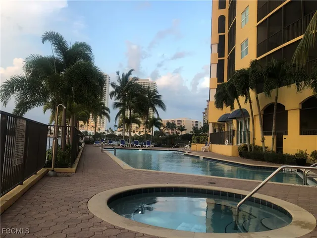 a view of a swimming pool with a patio